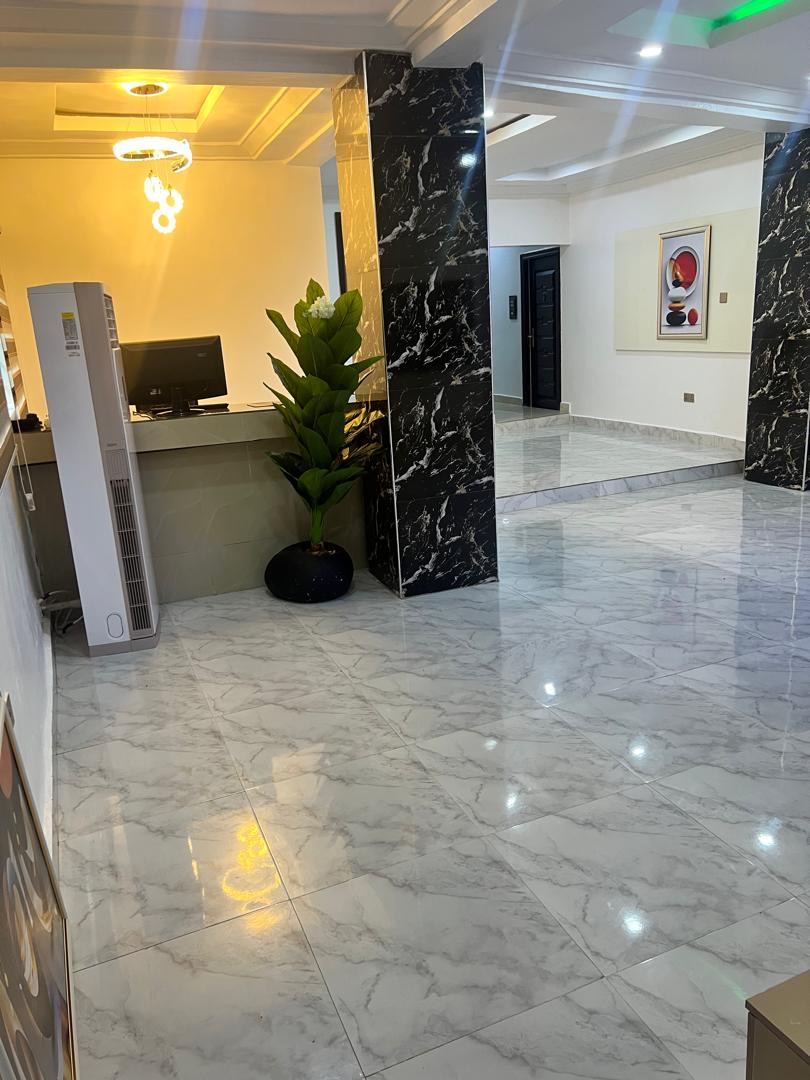 Govaxoni Suites reception desk with computer